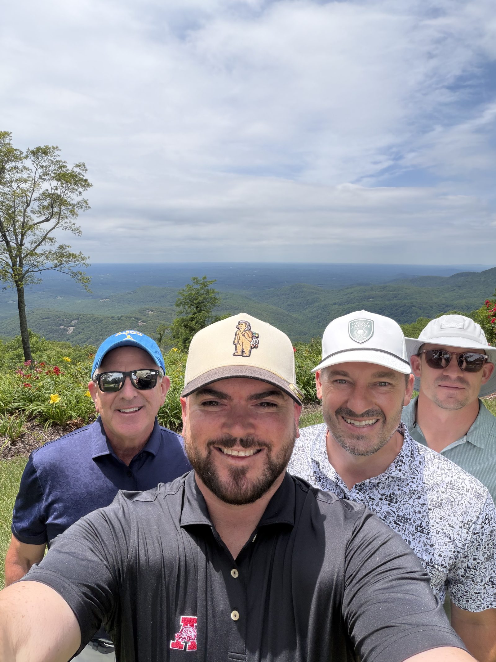 The four founders of Cornell Brands together on the course